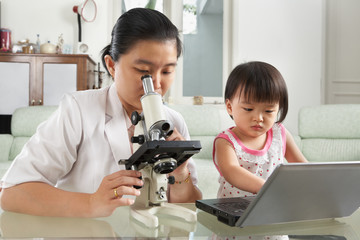 Mother and daughter busy on their own