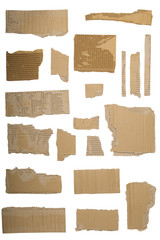 Pieces of torn brown corrugated cardboard, Isolated on White