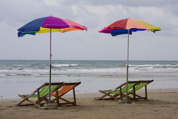 Beach chairs, parasol at a beach.Thailand.