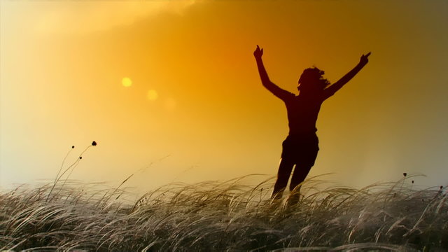 Girl happily jumped on the field