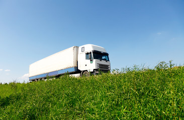 White truck driving on the road