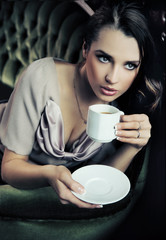 Young beautiful lady drinking coffee