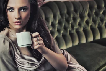 Foto op Aluminium Portrait of a beautiful lady drinking afternoon coffee © konradbak