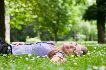 Happy life - lying in grass with flowers