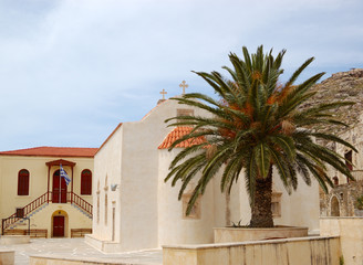 Fototapeta na wymiar Orthodox Church and palm tree, Crete, Greece