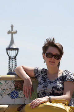 Woman on bench at park Guell
