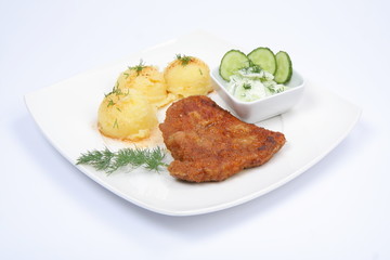Pork chop, potatoes and cucumber salad