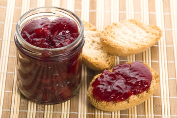 Breakfast of cherry jam on toast.