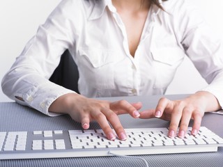 Business Woman Typing on Computer Keyboard