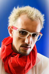 Fototapeta premium Man with red scarf against coloured background