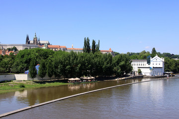Fototapeta premium The View on spring Prague's gothic Castle above River Vltava