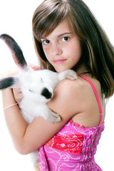 Beautiful young girl with a rabbit