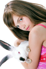 Beautiful young girl with a rabbit