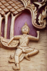 Fototapeta na wymiar art carving on window of Wat Nong Don, Borabue, Mahasarakam