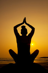 Sunset silhouette yoga pose