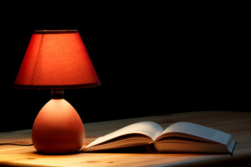 Lamp illuminating a book