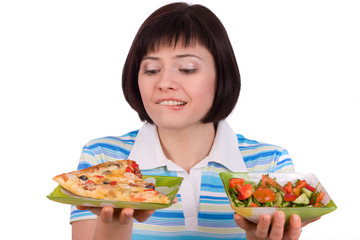 Woman makes choice of pizza and healthy salad