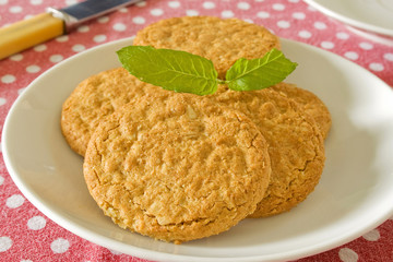 Brown wholemeal bicuits on a white plate