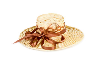 Straw hat with brown bowknot isolated on white