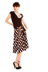 Alluring young girl in spotted skirt