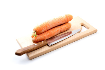 Carrots  and  knife on a chopping board