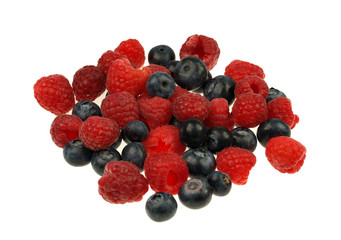 Raspberries and blueberries on white background