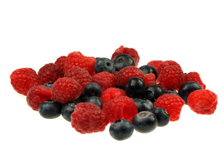 Raspberries and blueberries on white background