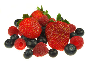Obraz na płótnie Canvas Raspberries,strawberries and blueberries on white background