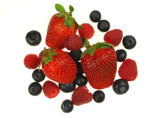 Fototapeta na wymiar Raspberries,strawberries and blueberries on white background