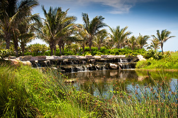 Fototapeta na wymiar Rock Waterfall on Golf Course, Florida