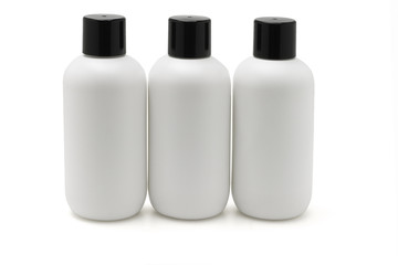 Three white plastic bottles