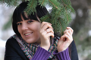 The girl under a fur-tree