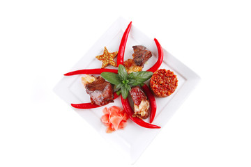 roast meat chunks on white plate