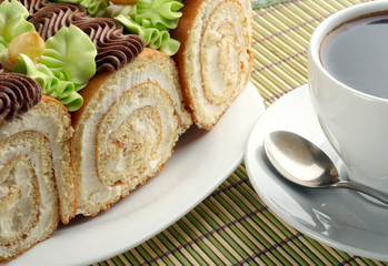 Swiss rolls and cup of coffee