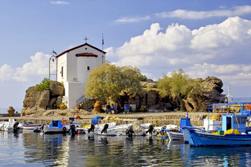 Chapel on rocks in the port of Skala Sykamineas