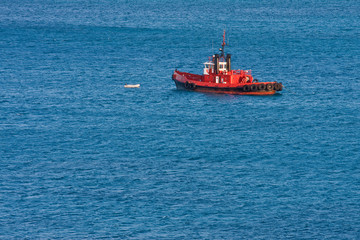Bright Orange Pilot Boat on Blue