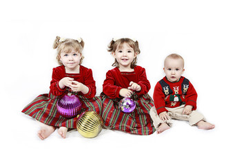 Three Children isolated on white in christmas outfits