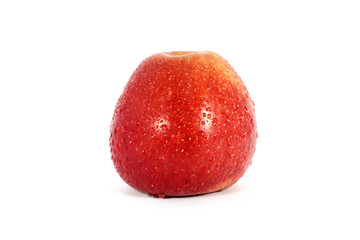 Ripe fresh red apple with water drops