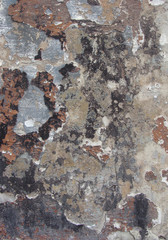 dirty worn white gray wall with remains of orange black blue