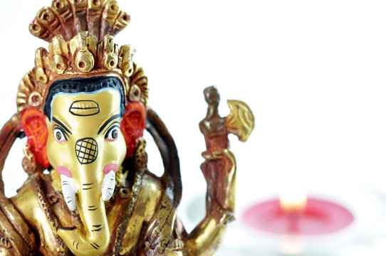 Ganesh statue and a candle
