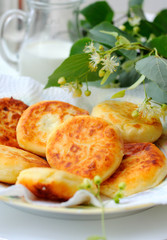 Curd pancakes with berries inside.