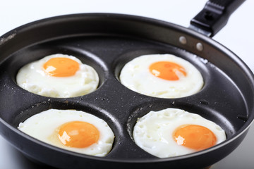 Four fried eggs