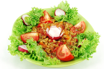 stew with green salad and tomatoes