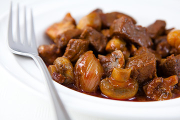 Braised beef with mushrooms and onion