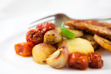 Roasted vegetables on white plate