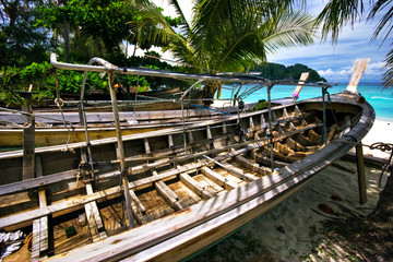 Old Thai boat at the beach. Phi Phi island. Thailand