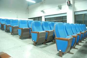 blue chairs in conference room