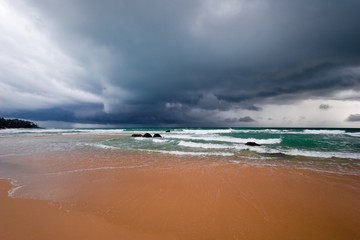 Gloomy weather on the tropical beach.