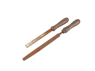 Two old, rusty rasps or files on a plain white background.