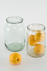 Apricots, placed in a glass jar, prepared for canning
